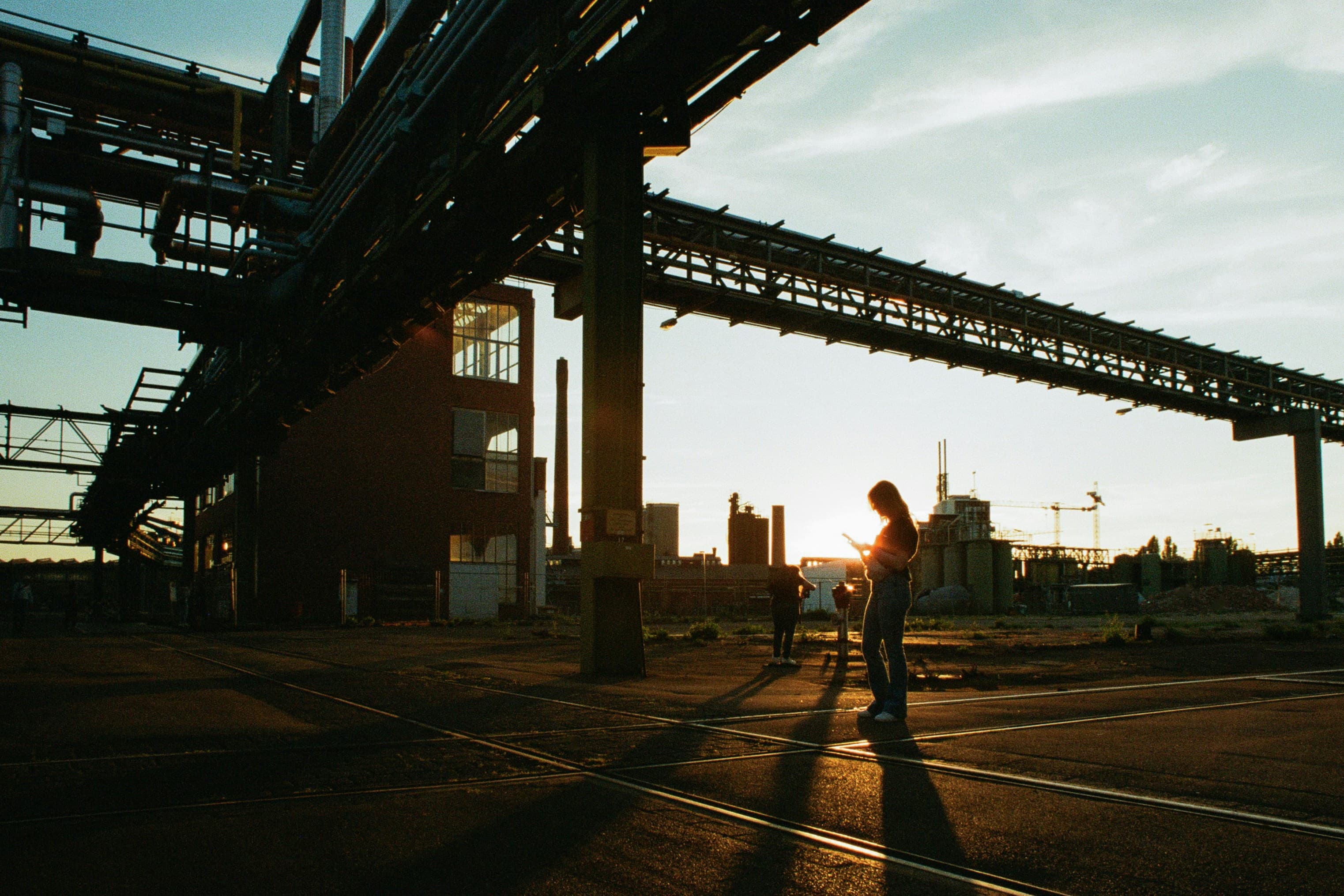 Worker inspecting metal scrap in a warehouse